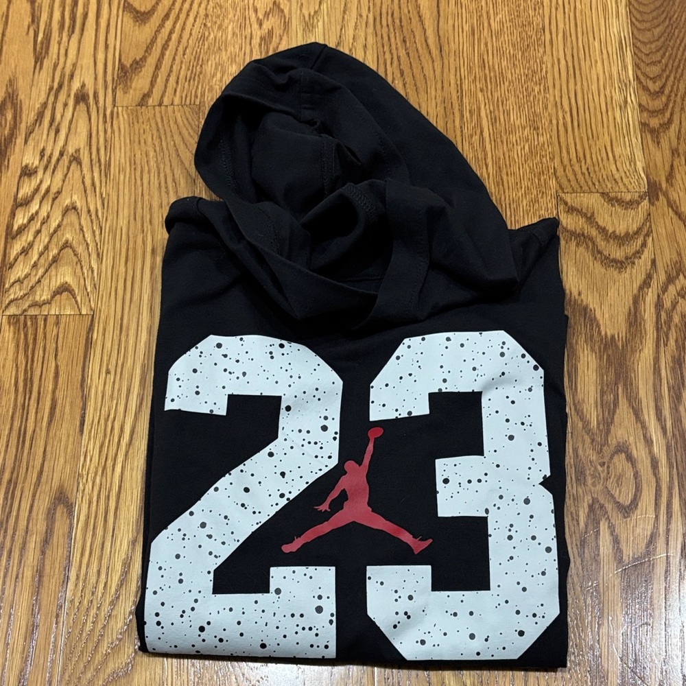Jordan Black long sleeve shirt with hood. Red and White Logo